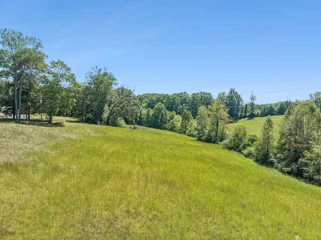 a view of a swimming pool with an outdoor space and seating area
