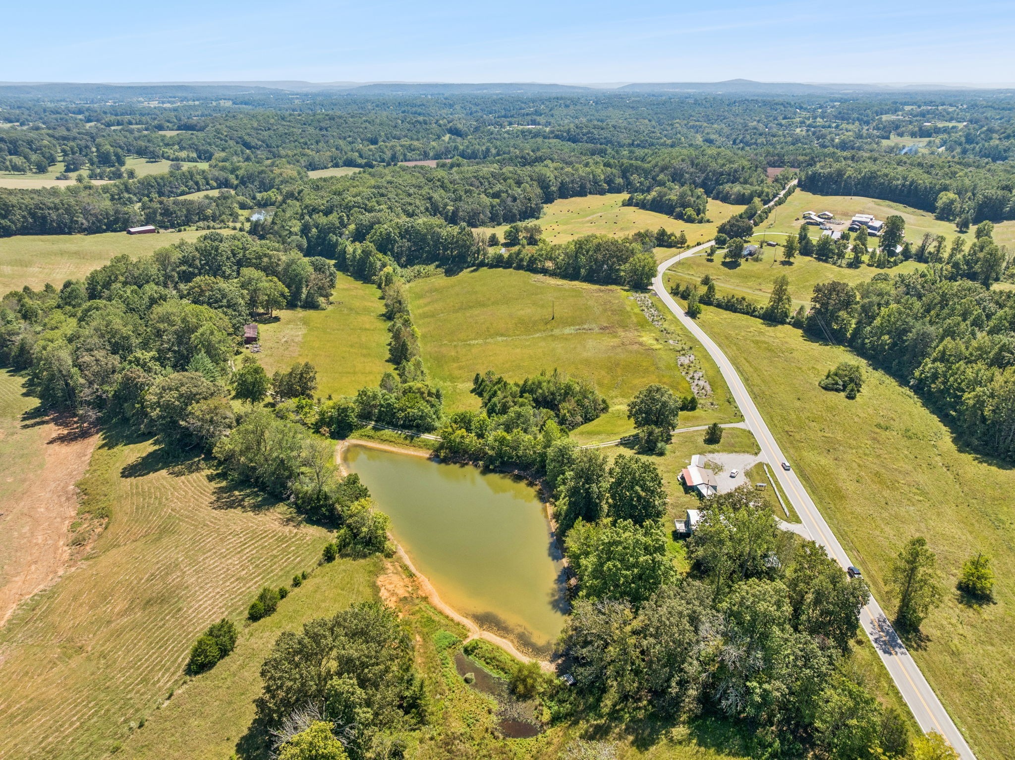 8272 Burgess Falls Road Baxter, TN 38544 - Photo 30 of 41 a view of a lake with a mountain