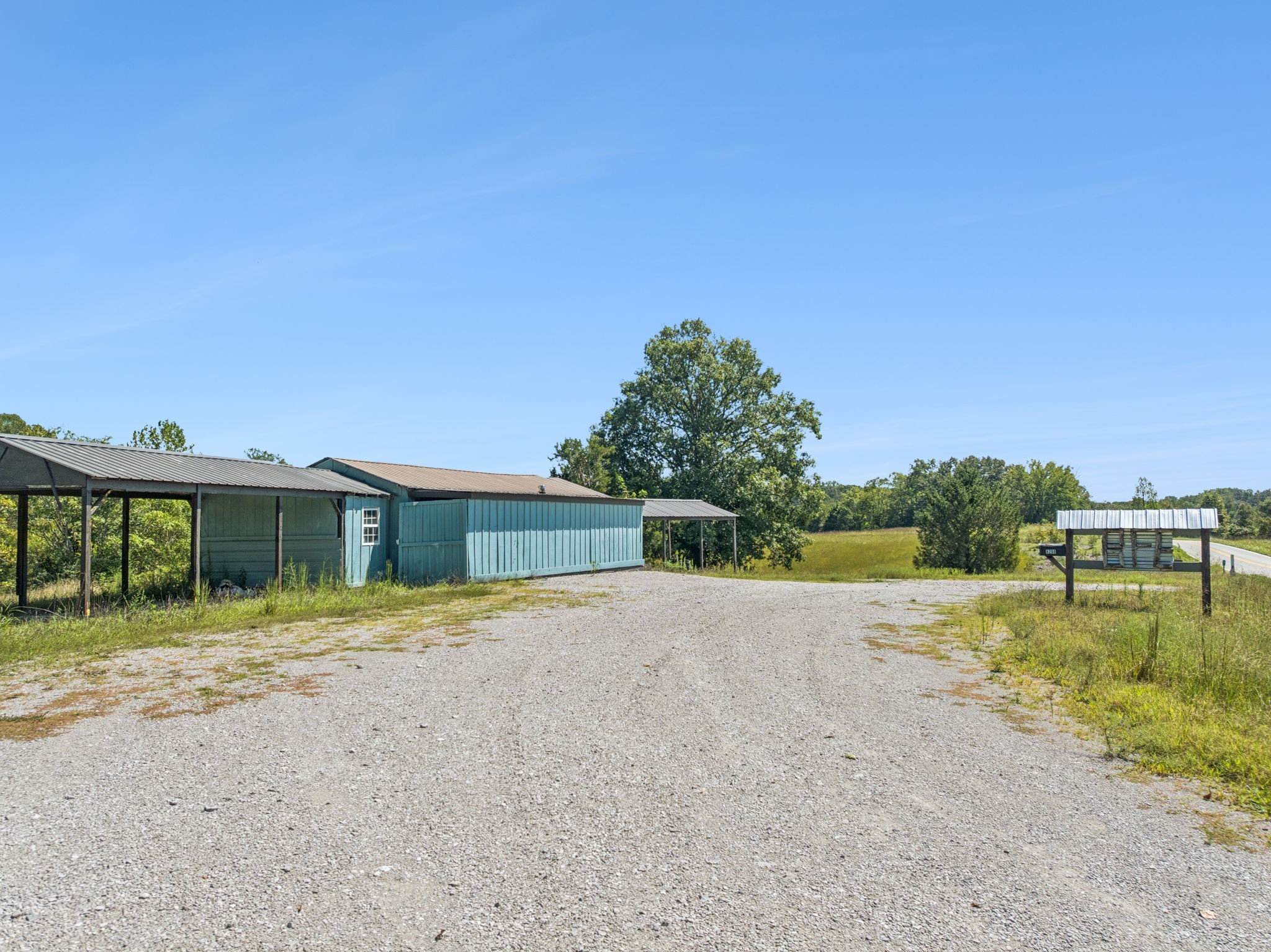 8272 Burgess Falls Road Baxter, TN 38544 - Photo 36 of 41 a view of a house with a yard and lake view
