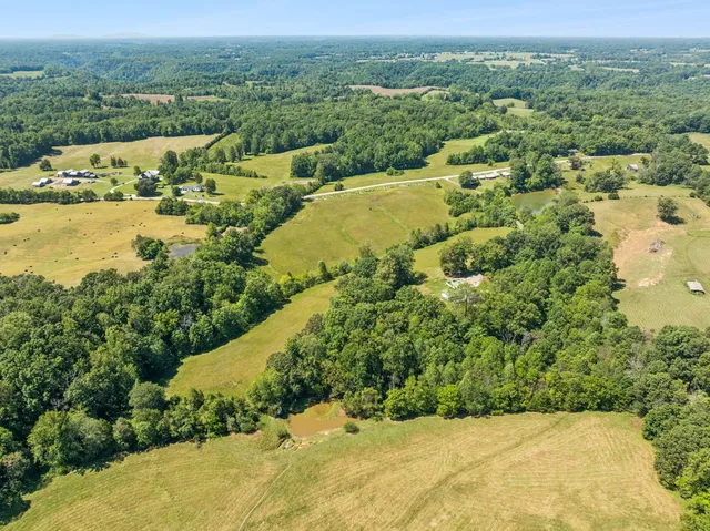 a view of a swimming pool with an outdoor space and seating area