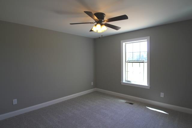 502 Taylor Road Manchester, TN 37355 - Photo 10 of 14 an empty room with a window and a fan