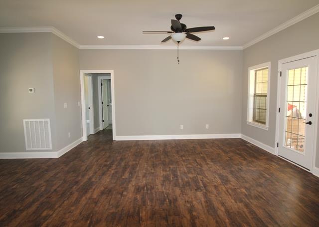 502 Taylor Road Manchester, TN 37355 - Photo 2 of 14 a view of empty room with wooden floor and fan