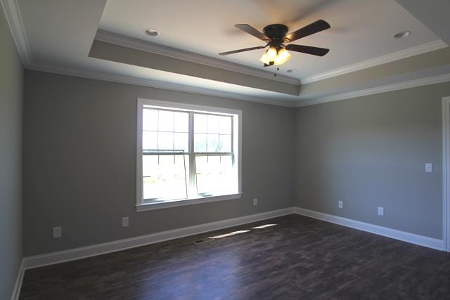 502 Taylor Road Manchester, TN 37355 - Photo 7 of 14 a view of an empty room with wooden floor and a window