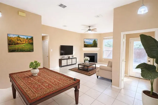 a living room with furniture and a flat screen tv