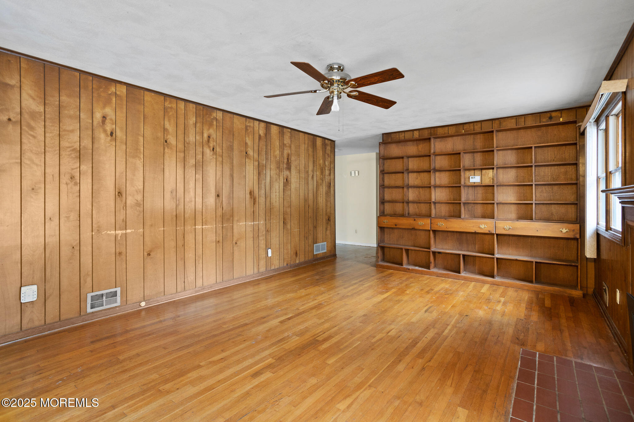 1 Hawk Drive Princeton Junction, NJ 08550 - Photo 12 of 46 a view of an empty room with wooden floor and a window