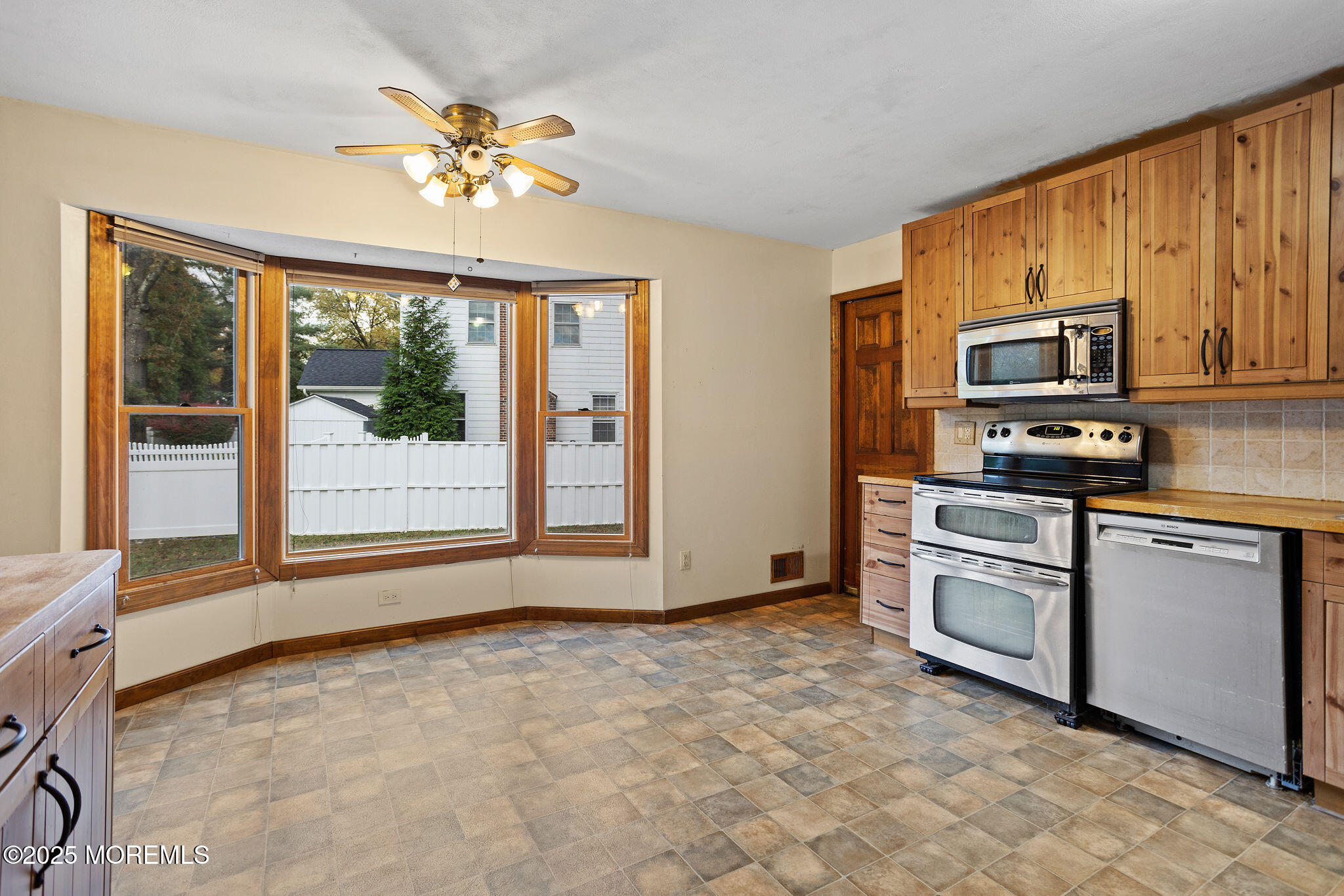 1 Hawk Drive Princeton Junction, NJ 08550 - Photo 24 of 46 a kitchen with stainless steel appliances granite countertop a stove top oven a sink a counter space and cabinets