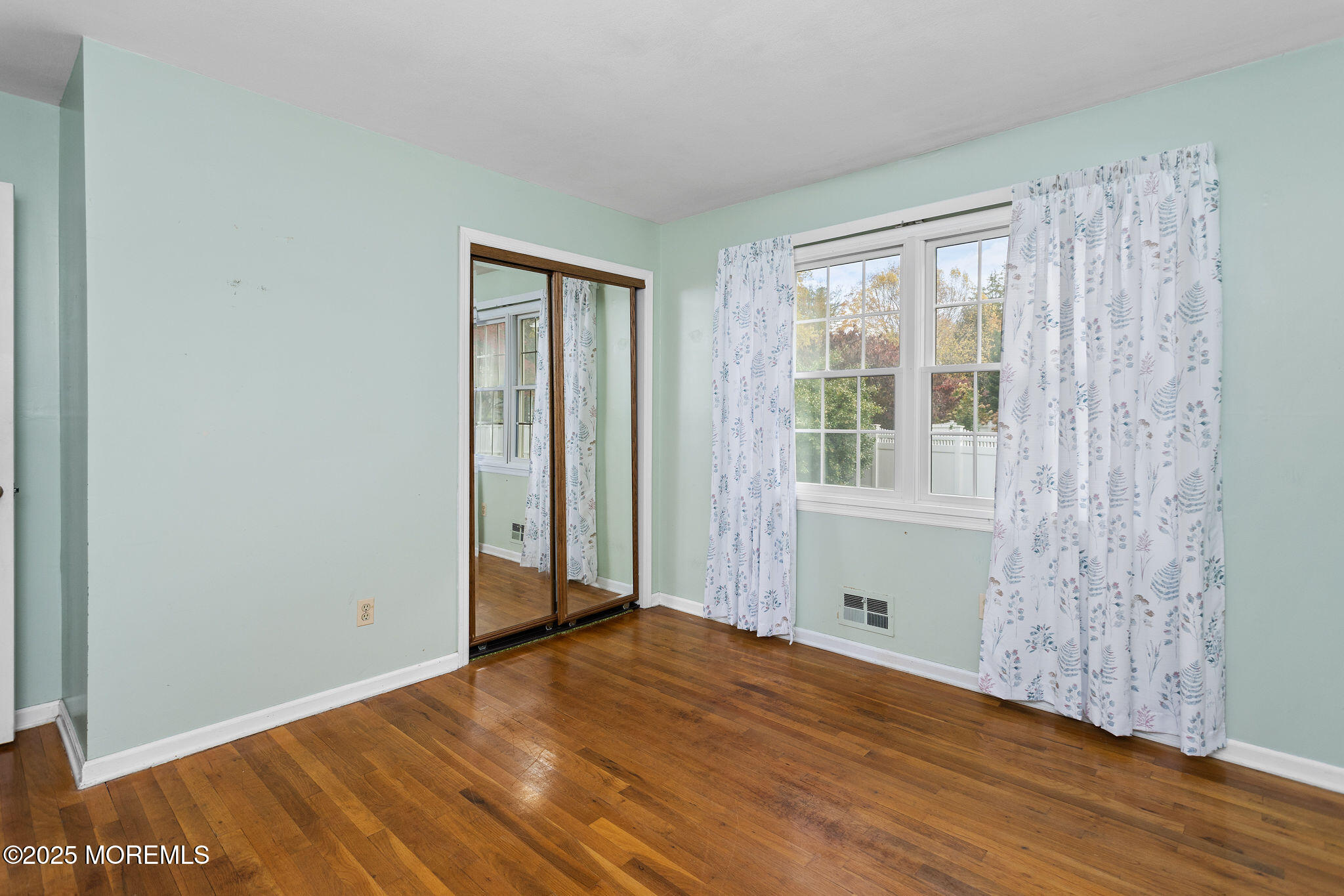 1 Hawk Drive Princeton Junction, NJ 08550 - Photo 26 of 46 a view of an empty room with wooden floor and a window