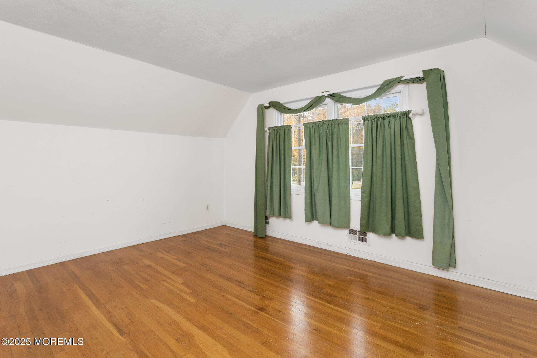 1 Hawk Drive Princeton Junction, NJ 08550 - Photo 28 of 46 a view of an empty room with wooden floor and a glass door