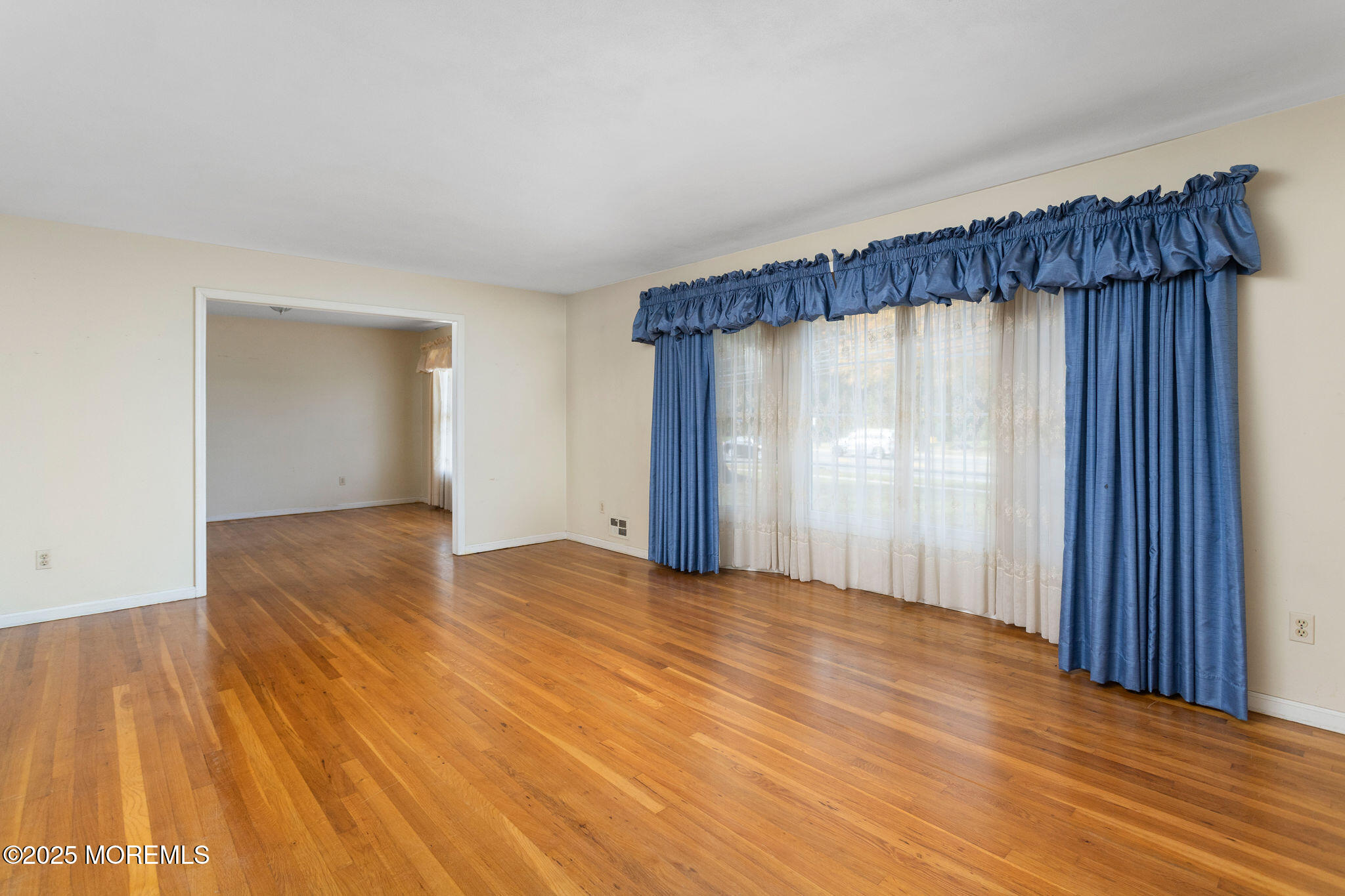1 Hawk Drive Princeton Junction, NJ 08550 - Photo 8 of 46 a view of an empty room with wooden floor and a window