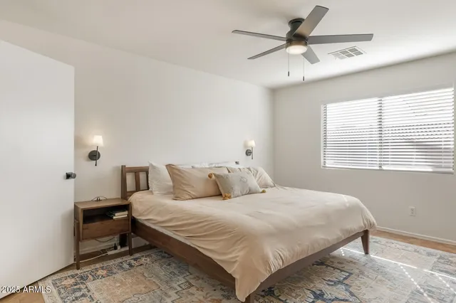a bedroom with furniture and a window