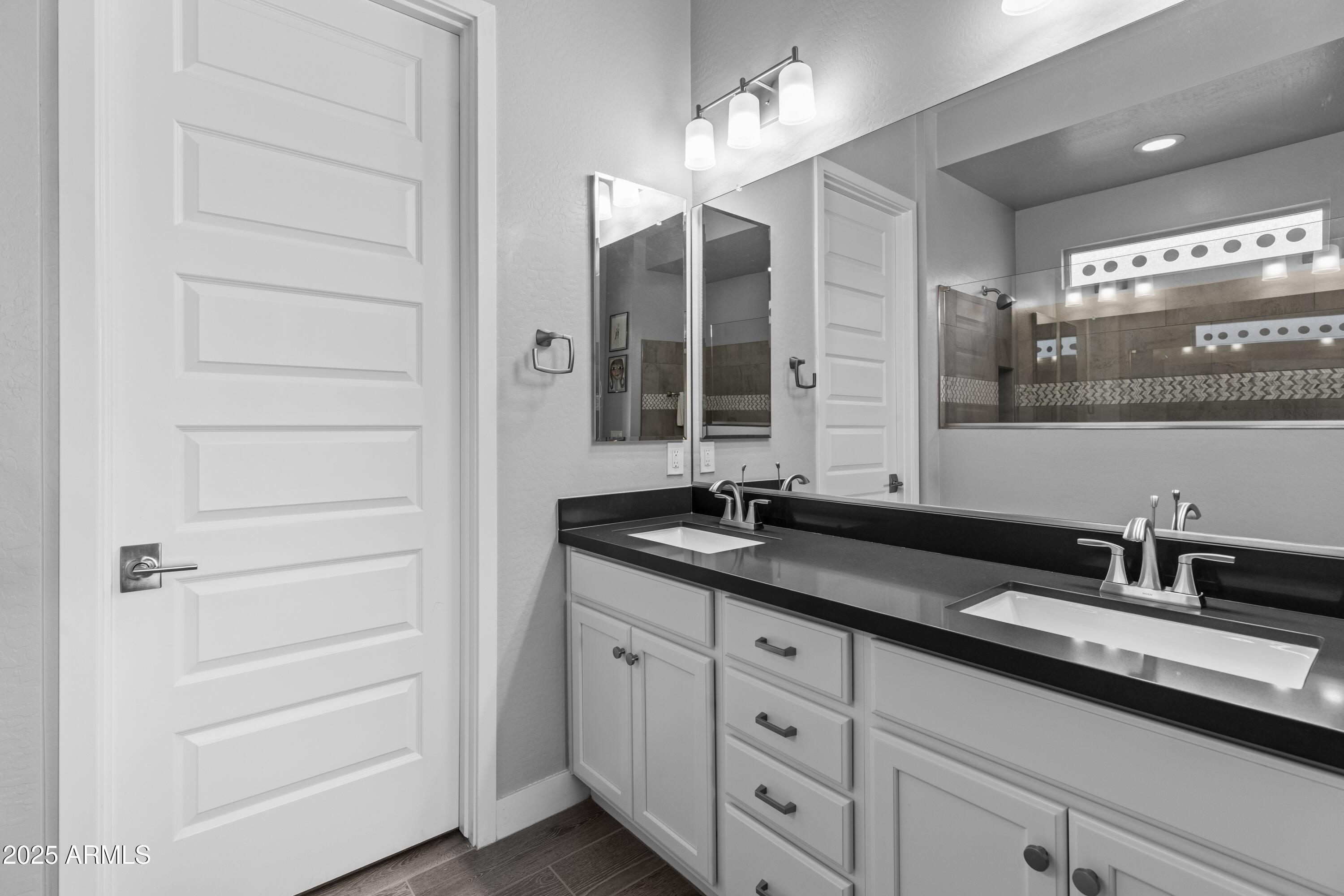 18788 East Blue Sky Drive Rio Verde, AZ 85263 - Photo 25 of 80 a bathroom with a granite countertop sink and a mirror