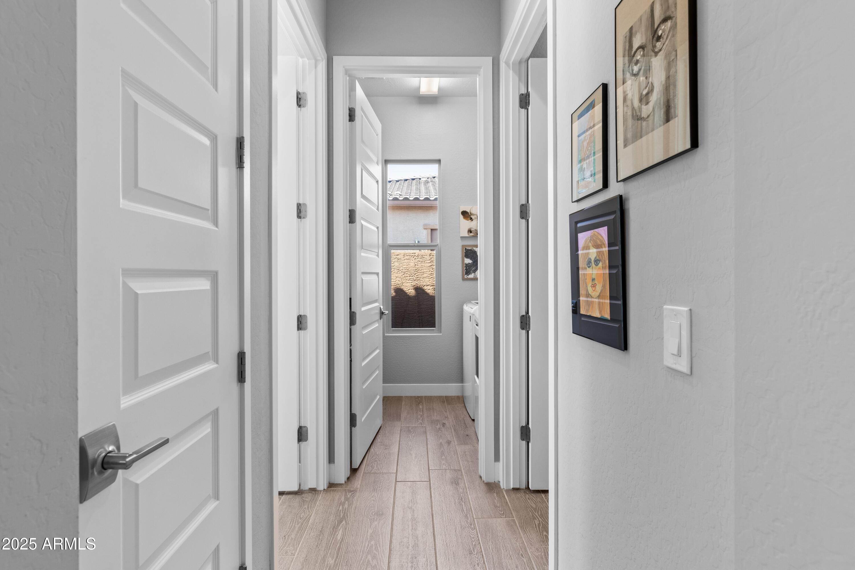 18788 East Blue Sky Drive Rio Verde, AZ 85263 - Photo 26 of 80 a view of a hallway with wooden floor and entryway
