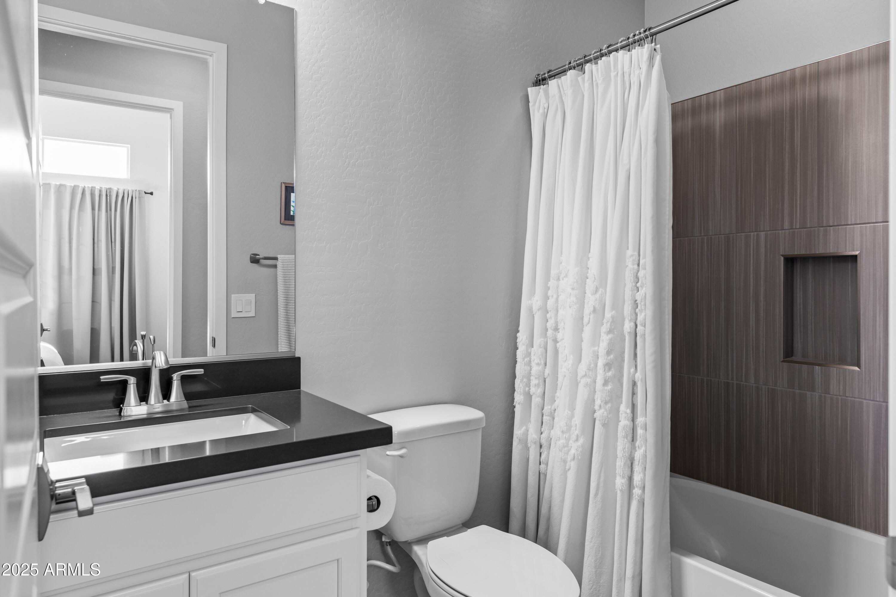 18788 East Blue Sky Drive Rio Verde, AZ 85263 - Photo 29 of 80 a bathroom with a granite countertop sink toilet and shower
