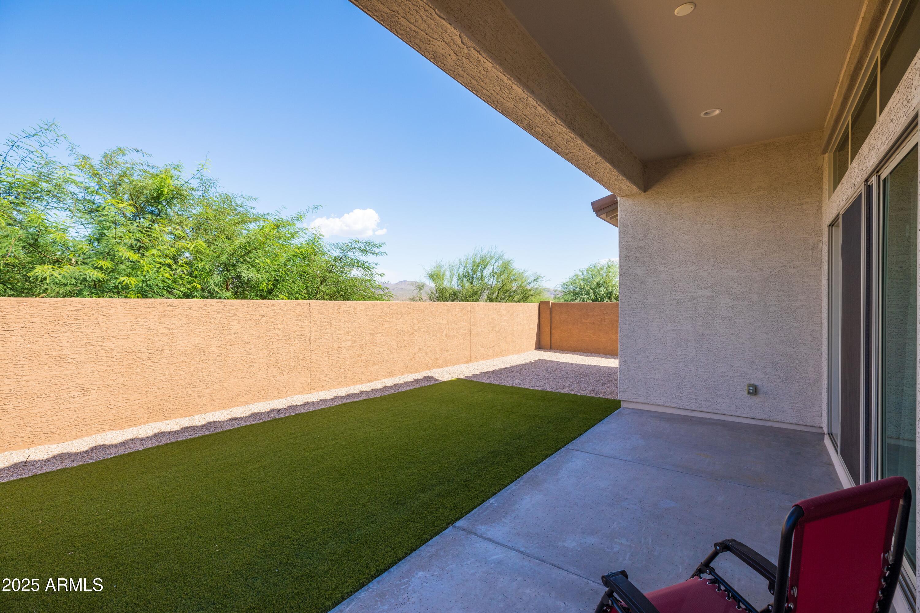 18788 East Blue Sky Drive Rio Verde, AZ 85263 - Photo 34 of 80 a backyard of a house with lots of green space