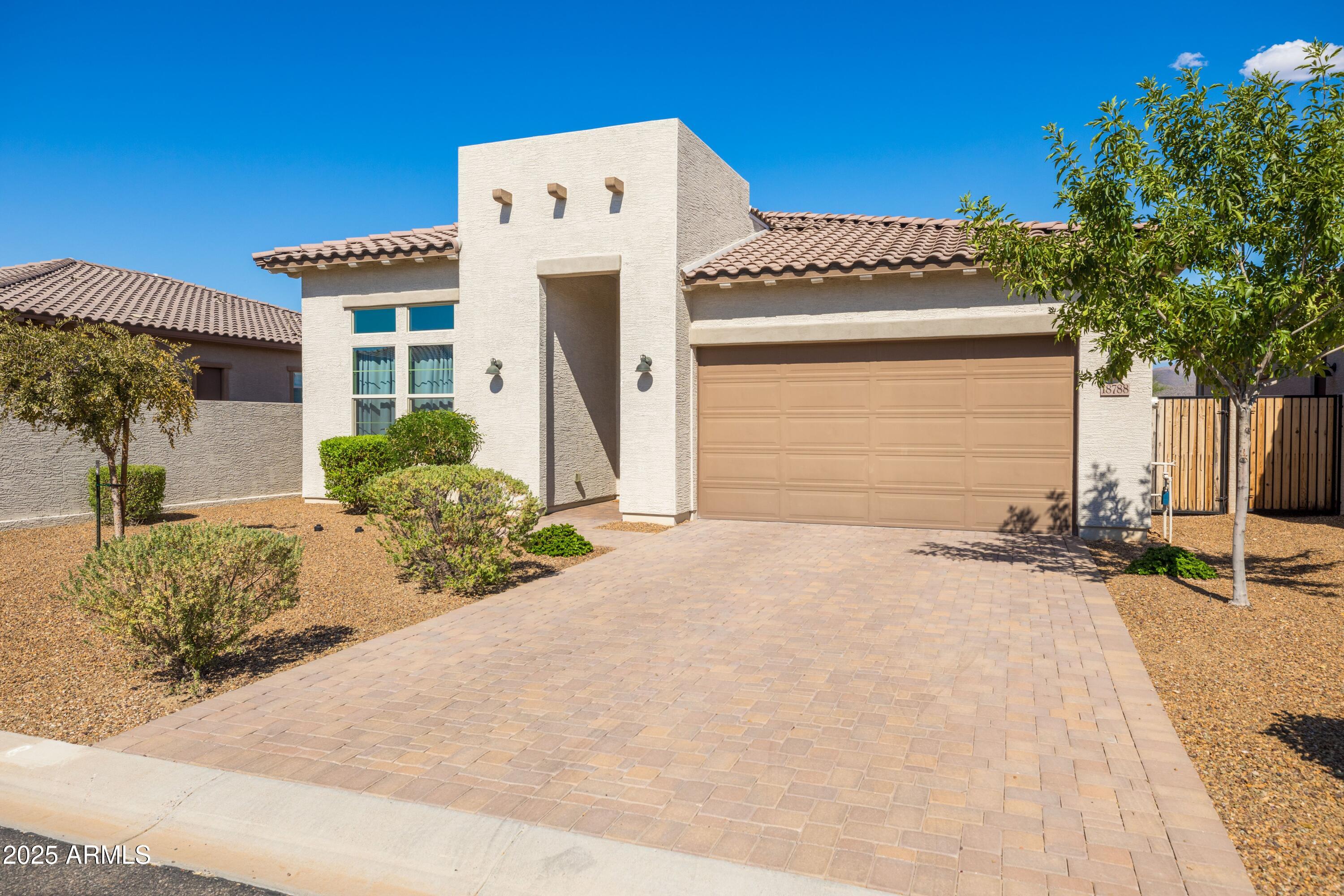 18788 East Blue Sky Drive Rio Verde, AZ 85263 - Photo 44 of 80 a front view of a house with a yard