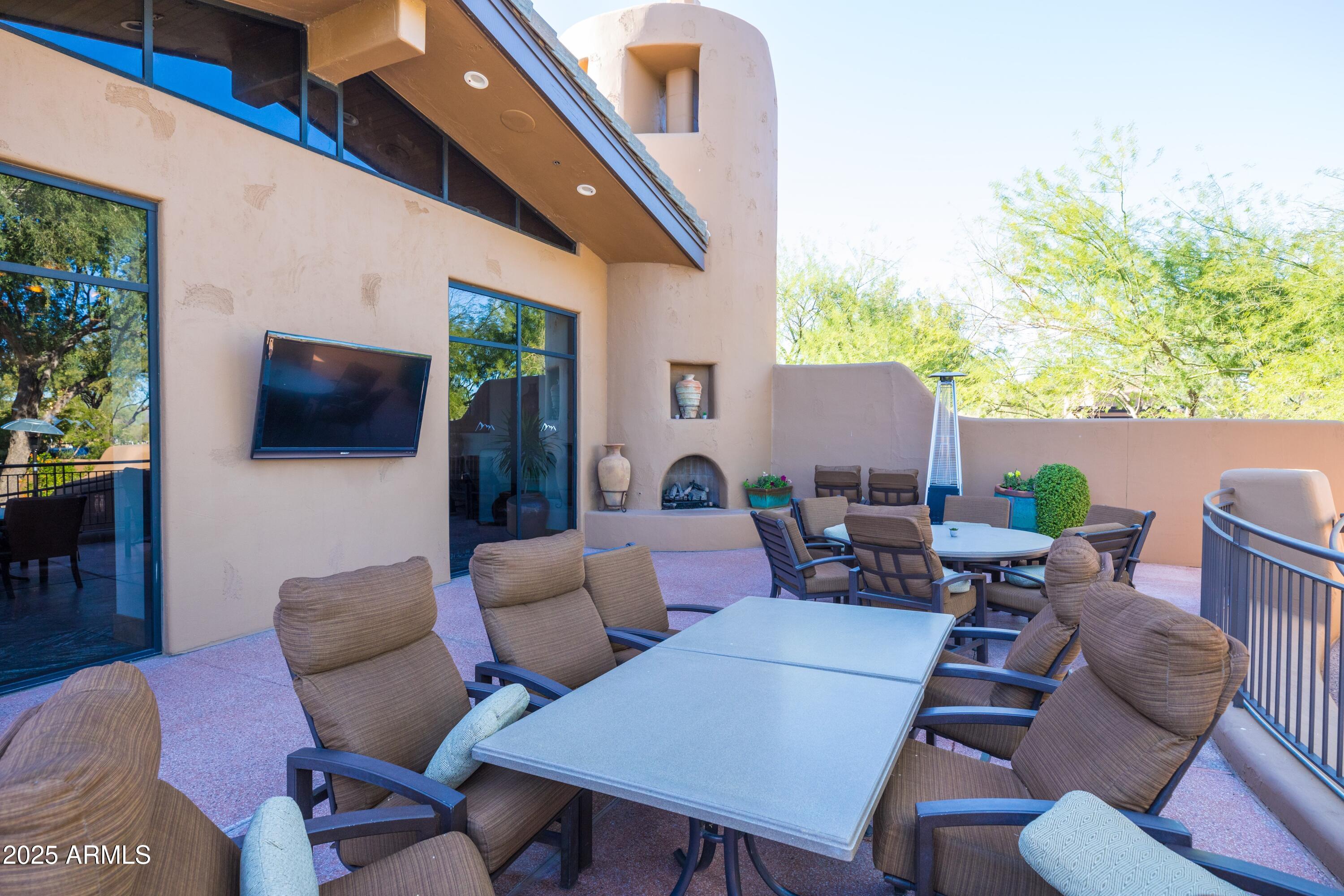 18788 East Blue Sky Drive Rio Verde, AZ 85263 - Photo 54 of 80 a outdoor living space with furniture potted plant view and a large window