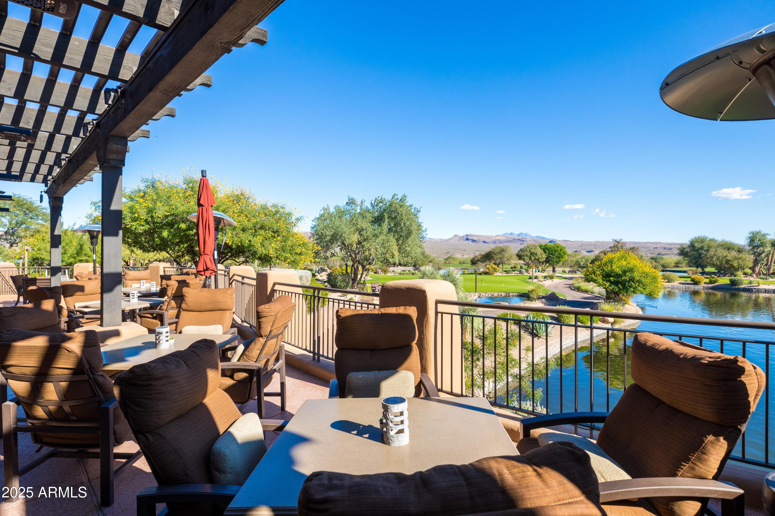18788 East Blue Sky Drive Rio Verde, AZ 85263 - Photo 57 of 80 a balcony with wooden floor and outdoor seating