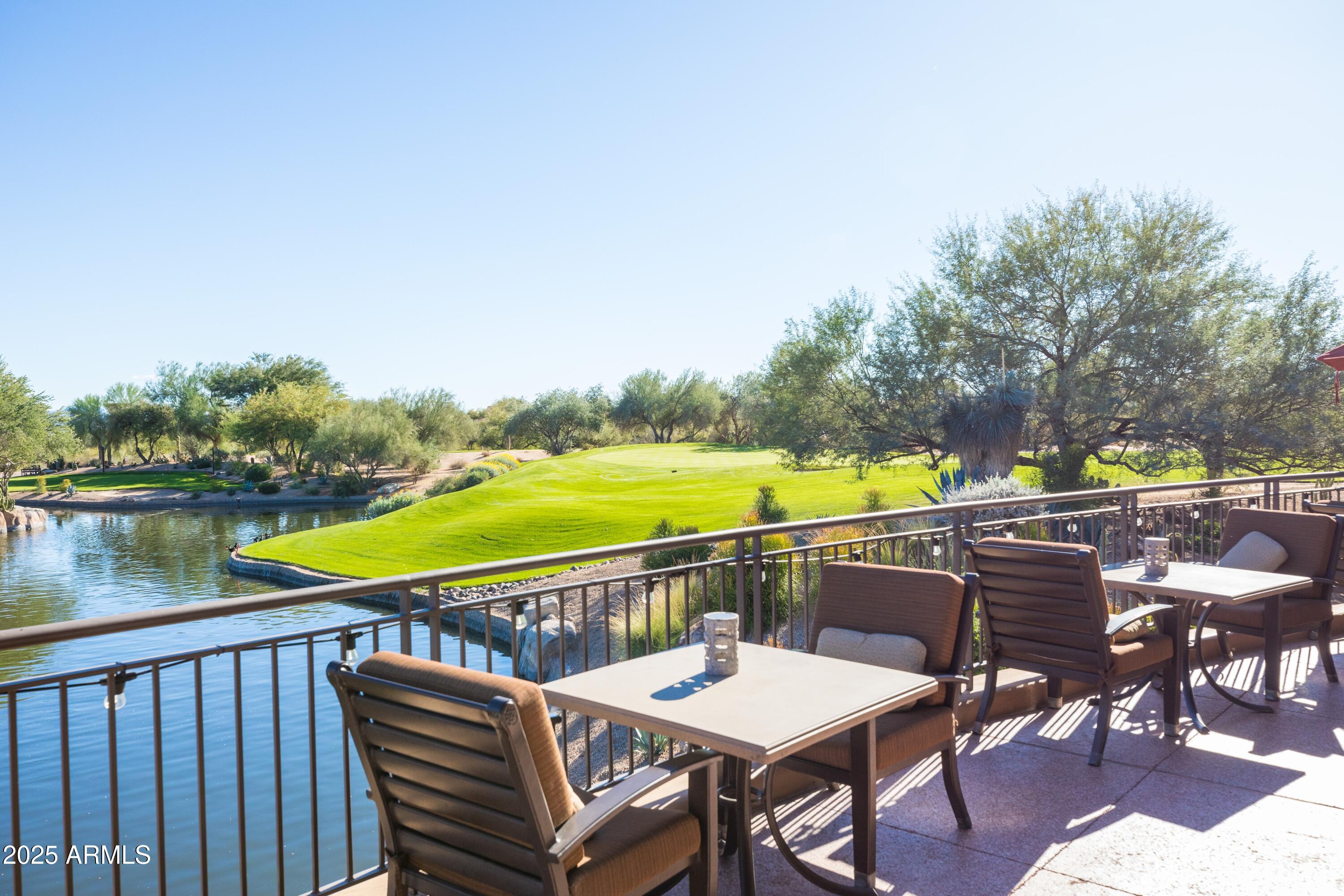18788 East Blue Sky Drive Rio Verde, AZ 85263 - Photo 61 of 80 a view of a balcony with lake view and wooden floor
