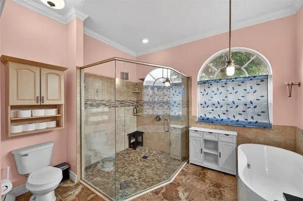 a bathroom with a granite countertop sink mirror vanity and toilet