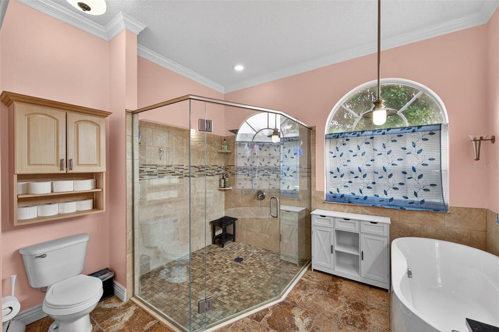 14178 Pullman Drive Spring Hill, FL 34609 - Photo 13 of 46 a bathroom with a granite countertop sink mirror vanity and toilet