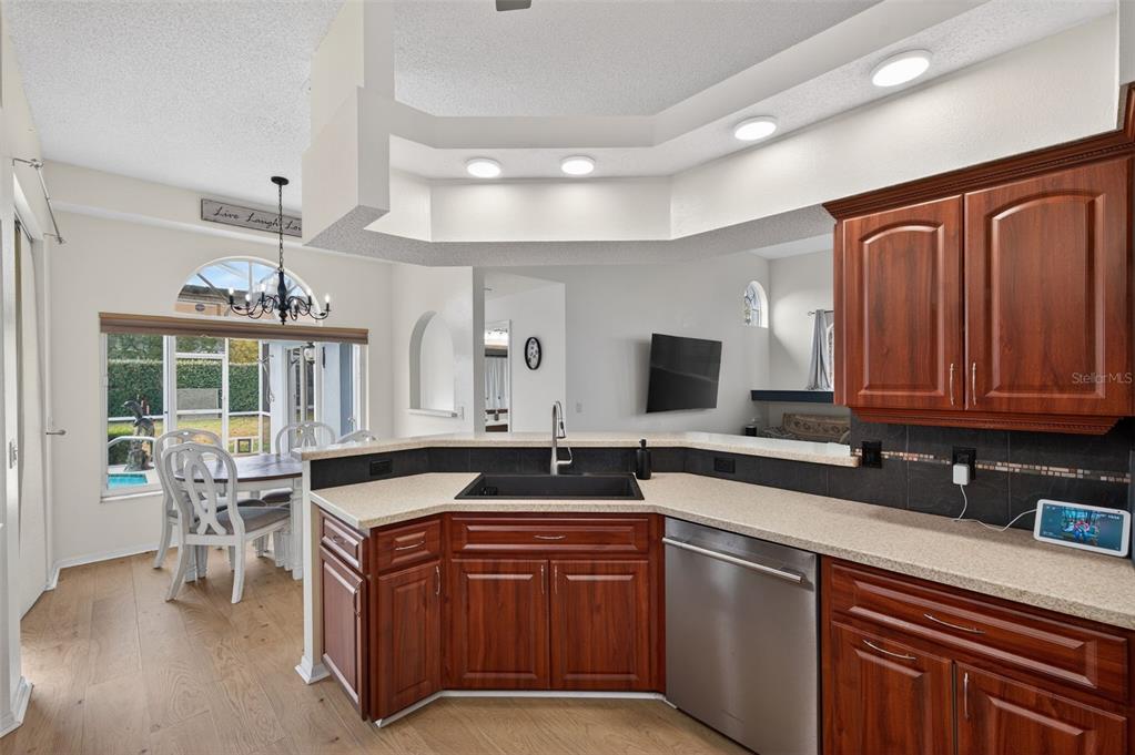 14178 Pullman Drive Spring Hill, FL 34609 - Photo 17 of 46 a kitchen with stainless steel appliances granite countertop a sink and a counter space