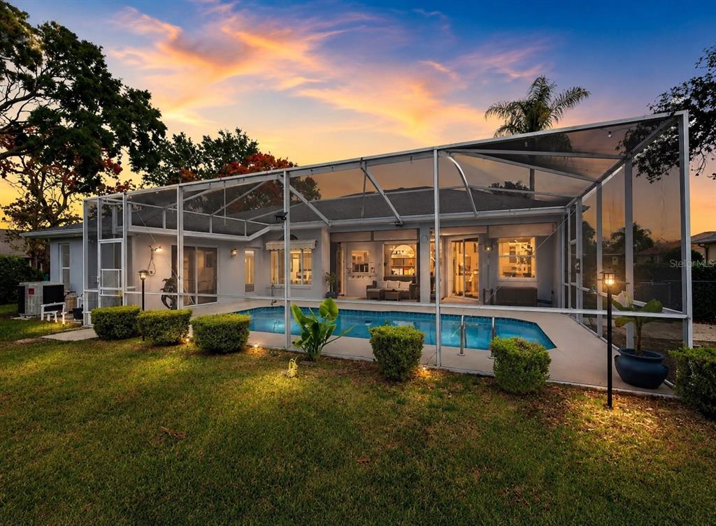 14178 Pullman Drive Spring Hill, FL 34609 - Photo 2 of 46 a front view of a house with garden