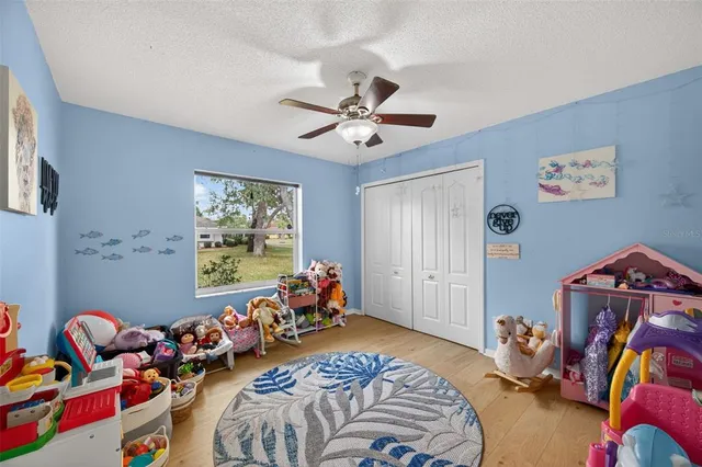 a view of a house with swimming pool in front of it