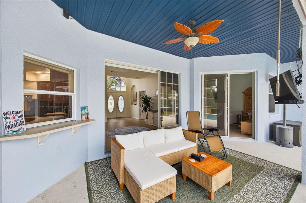 14178 Pullman Drive Spring Hill, FL 34609 - Photo 28 of 46 a living room with furniture a rug and a table