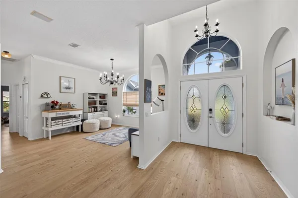 a view of living room with furniture and wooden floor