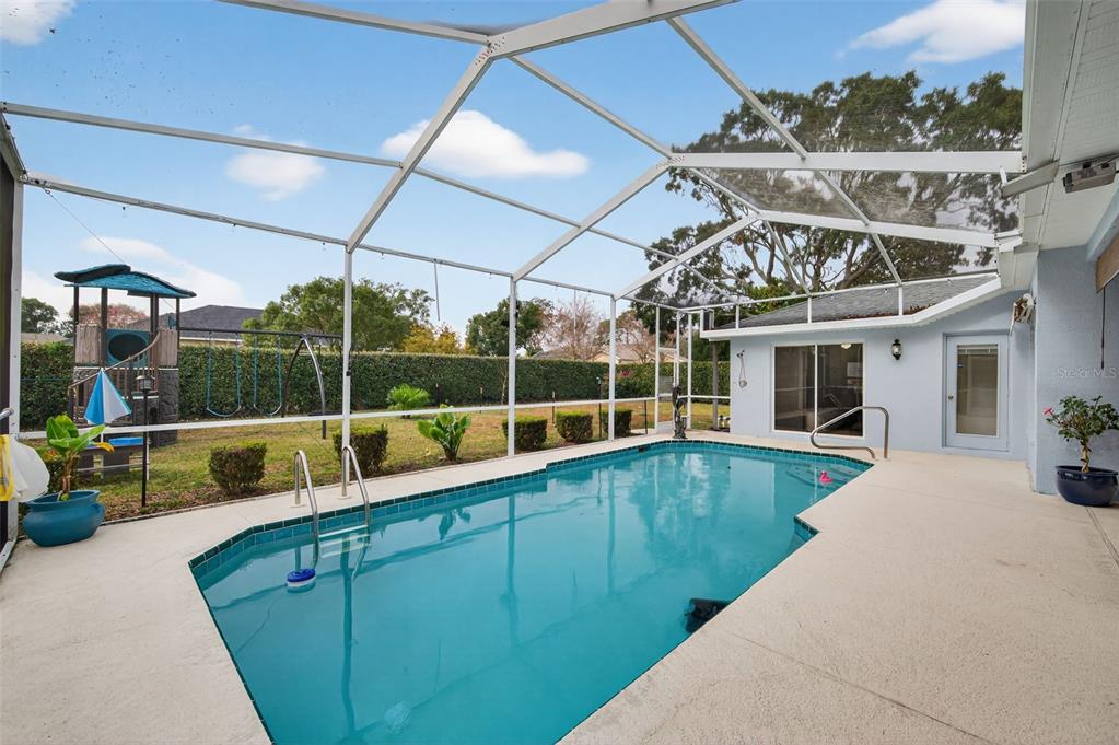 14178 Pullman Drive Spring Hill, FL 34609 - Photo 31 of 46 a view of a house with a swimming pool