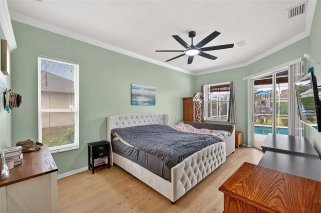 a bathroom with a sink a mirror and a painting on the wall
