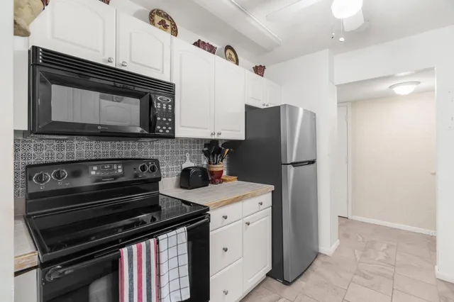 a kitchen with a stove microwave and refrigerator