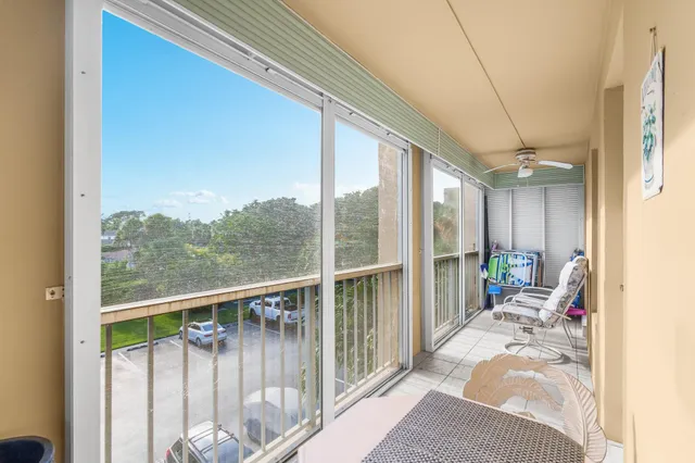 a view of balcony with furniture