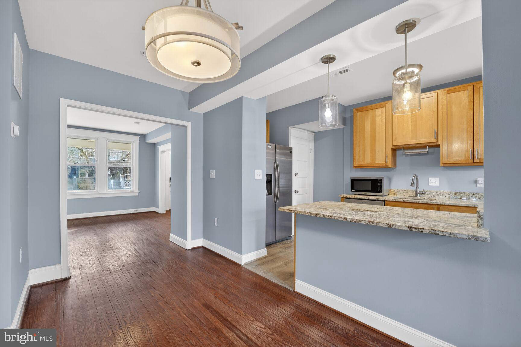 632 Franklin Street Northeast Washington, DC 20017 - Photo 3 of 19 a view of a kitchen counter space and wooden floor