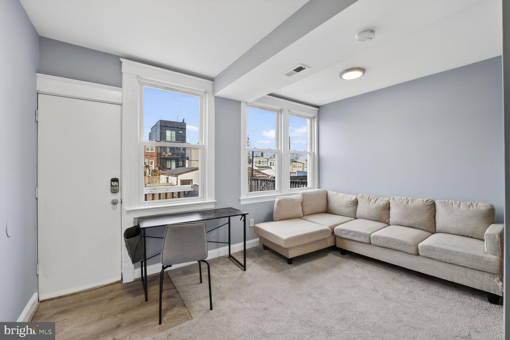 632 Franklin Street Northeast Washington, DC 20017 - Photo 7 of 19 a living room with furniture and a window
