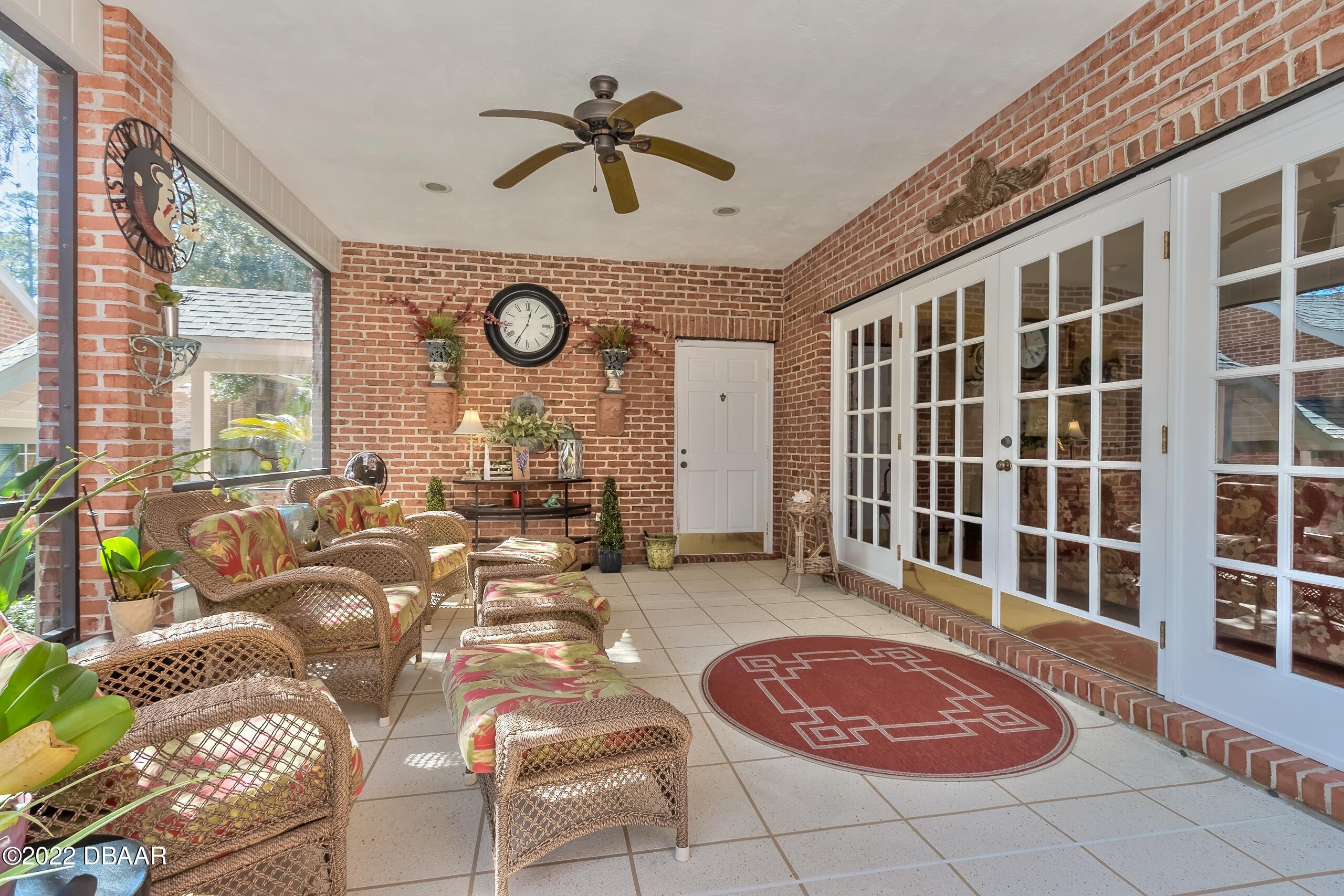 8 Moss Point Drive Ormond Beach, FL 32174 - Photo 18 of 63 a view of a livingroom with furniture and a large window
