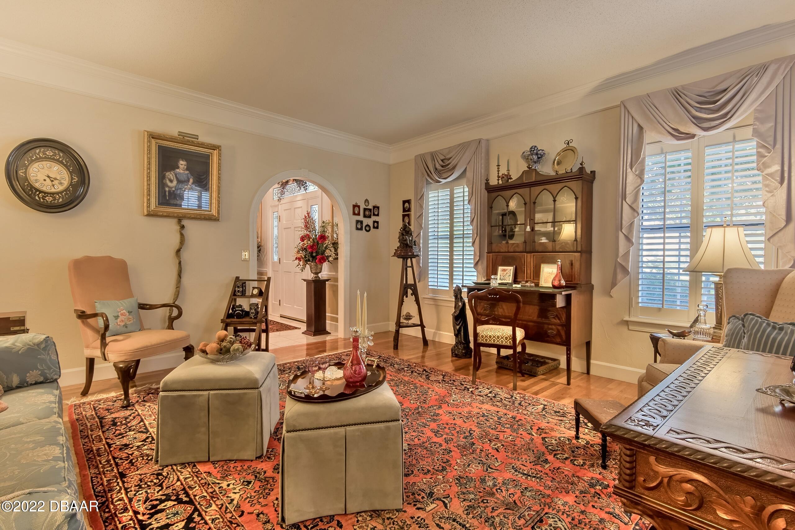 8 Moss Point Drive Ormond Beach, FL 32174 - Photo 19 of 63 a living room with furniture and a large window