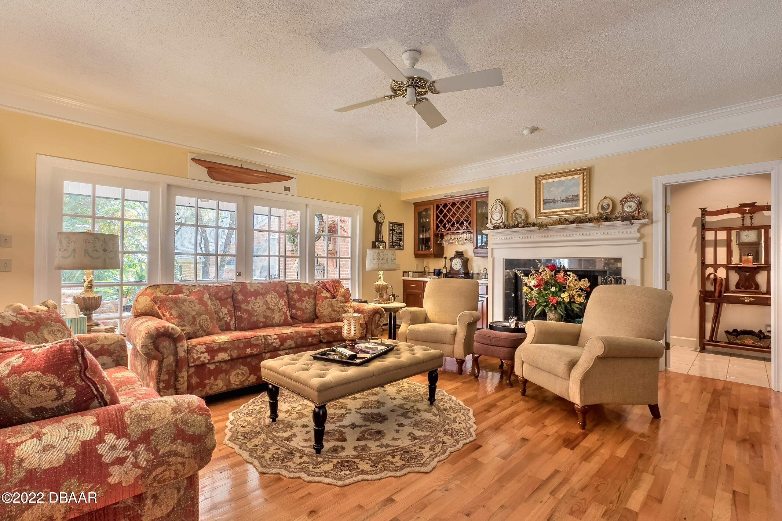 8 Moss Point Drive Ormond Beach, FL 32174 - Photo 29 of 63 a living room with furniture and a large window