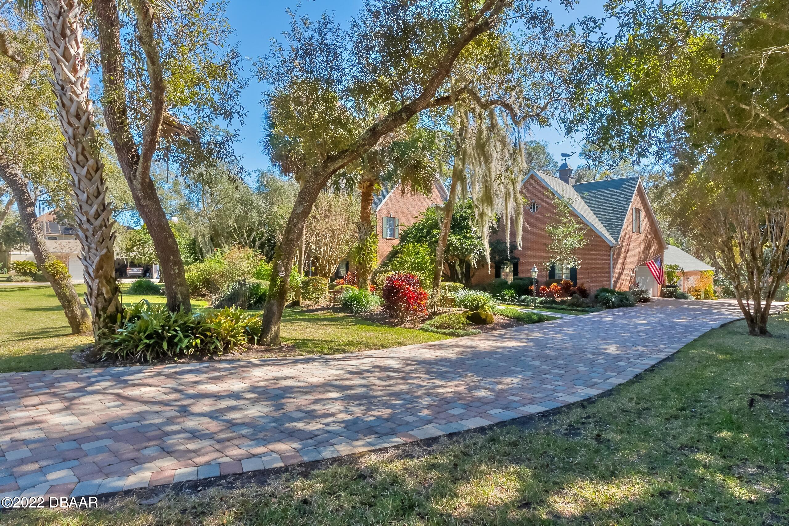 8 Moss Point Drive Ormond Beach, FL 32174 - Photo 3 of 63 a view of a park with large trees