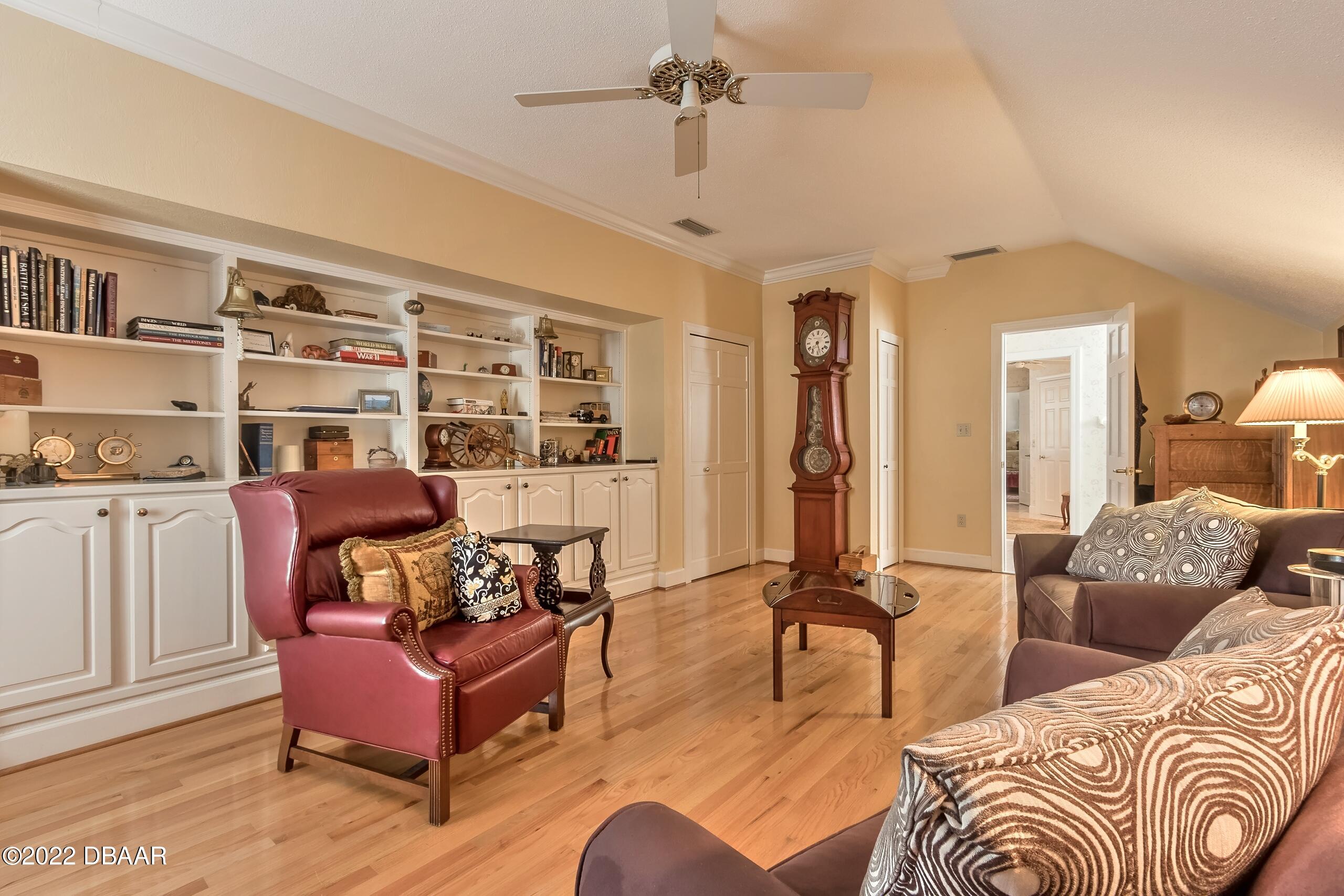8 Moss Point Drive Ormond Beach, FL 32174 - Photo 37 of 63 a living room with furniture and a large window