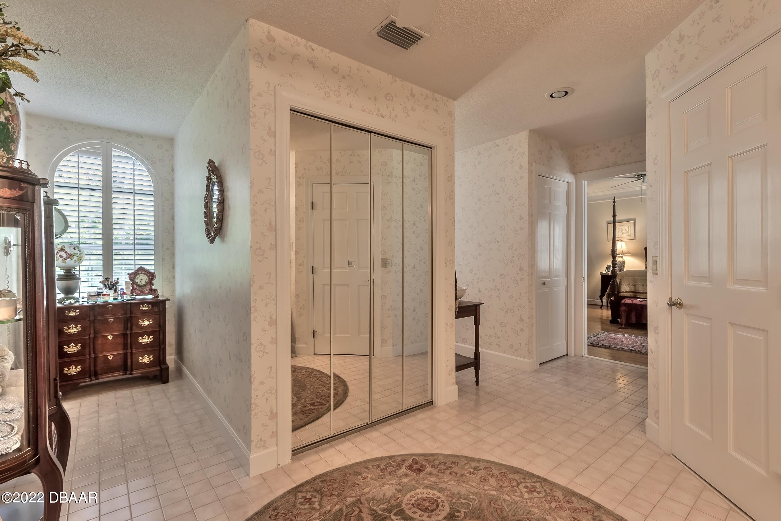 8 Moss Point Drive Ormond Beach, FL 32174 - Photo 40 of 63 a view of a livingroom with tub and windows