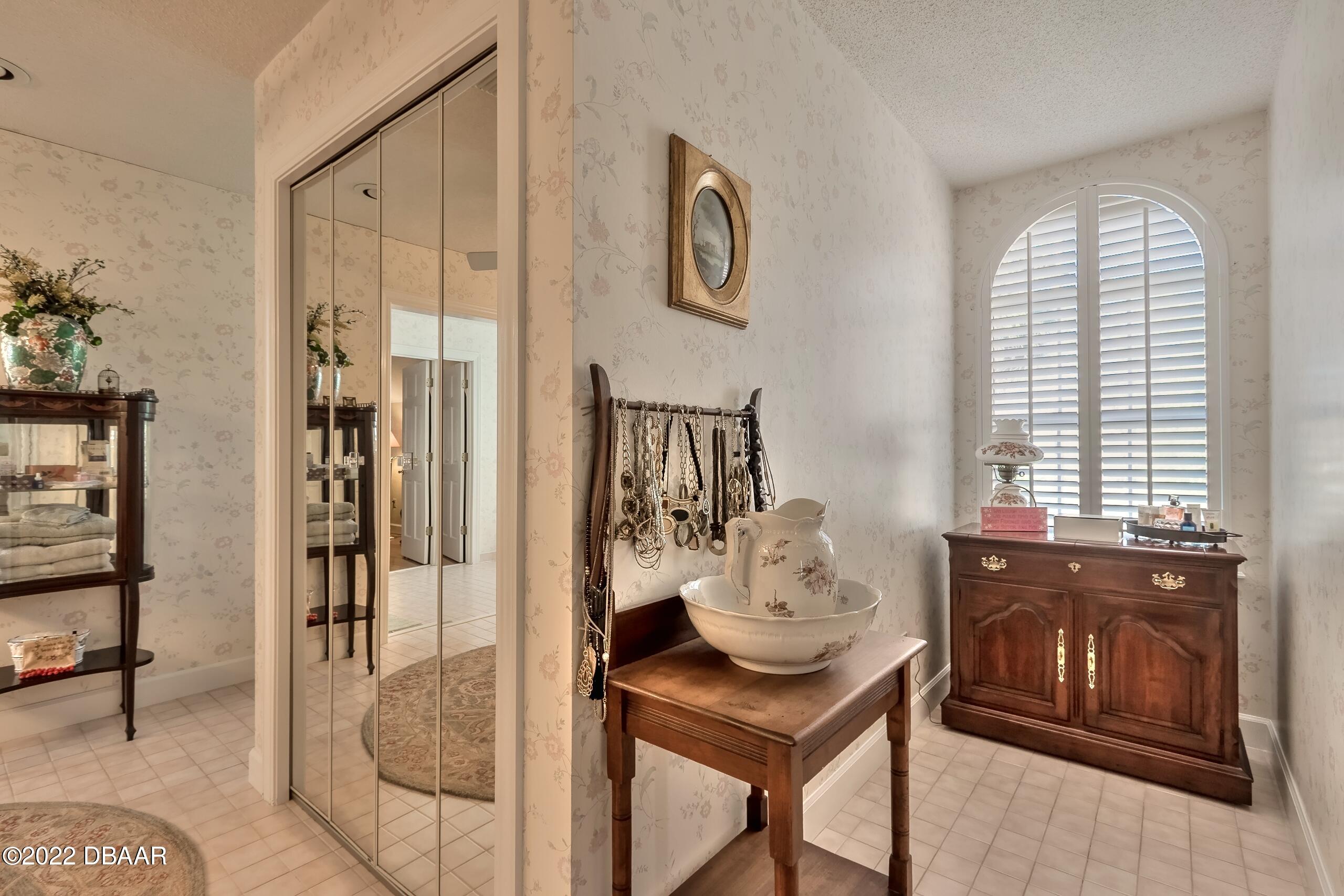 8 Moss Point Drive Ormond Beach, FL 32174 - Photo 41 of 63 a view of a livingroom with furniture and front door