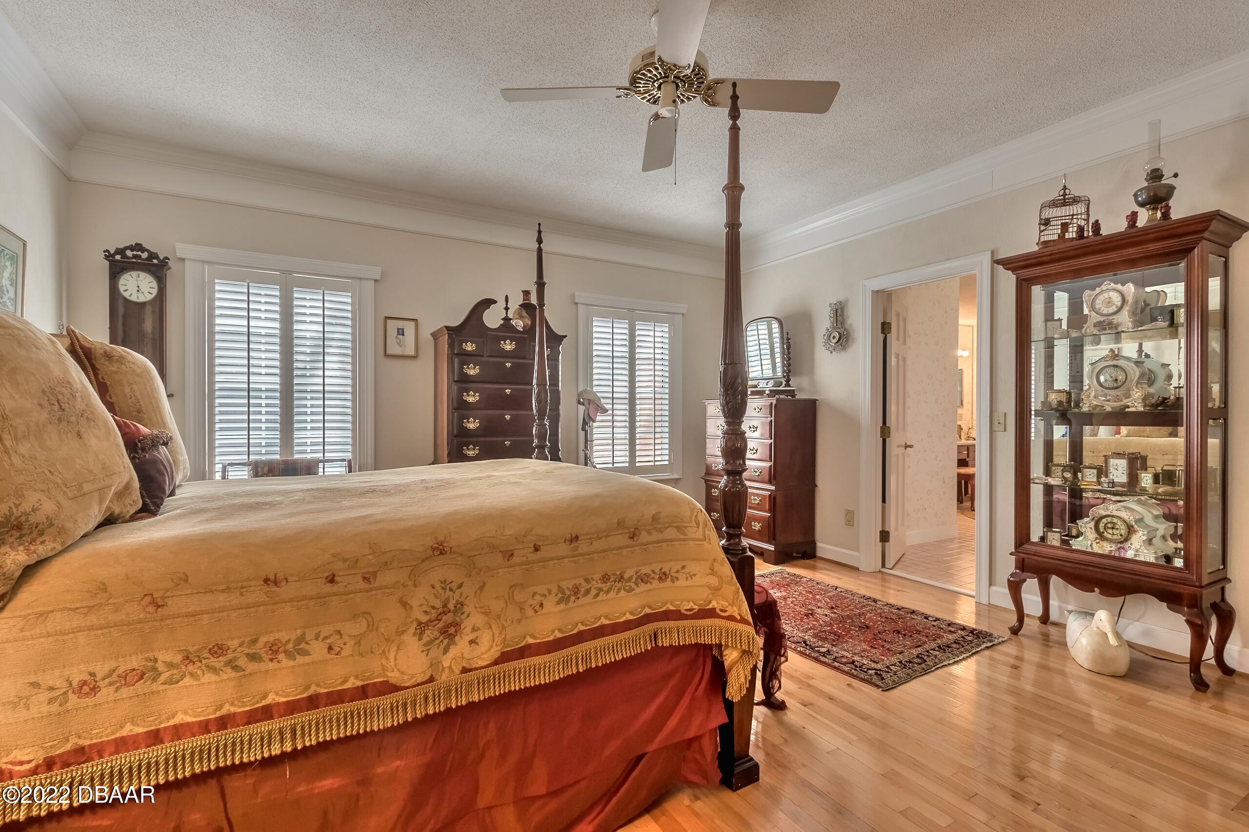 8 Moss Point Drive Ormond Beach, FL 32174 - Photo 44 of 63 a bed sitting in a spacious bedroom next to a window