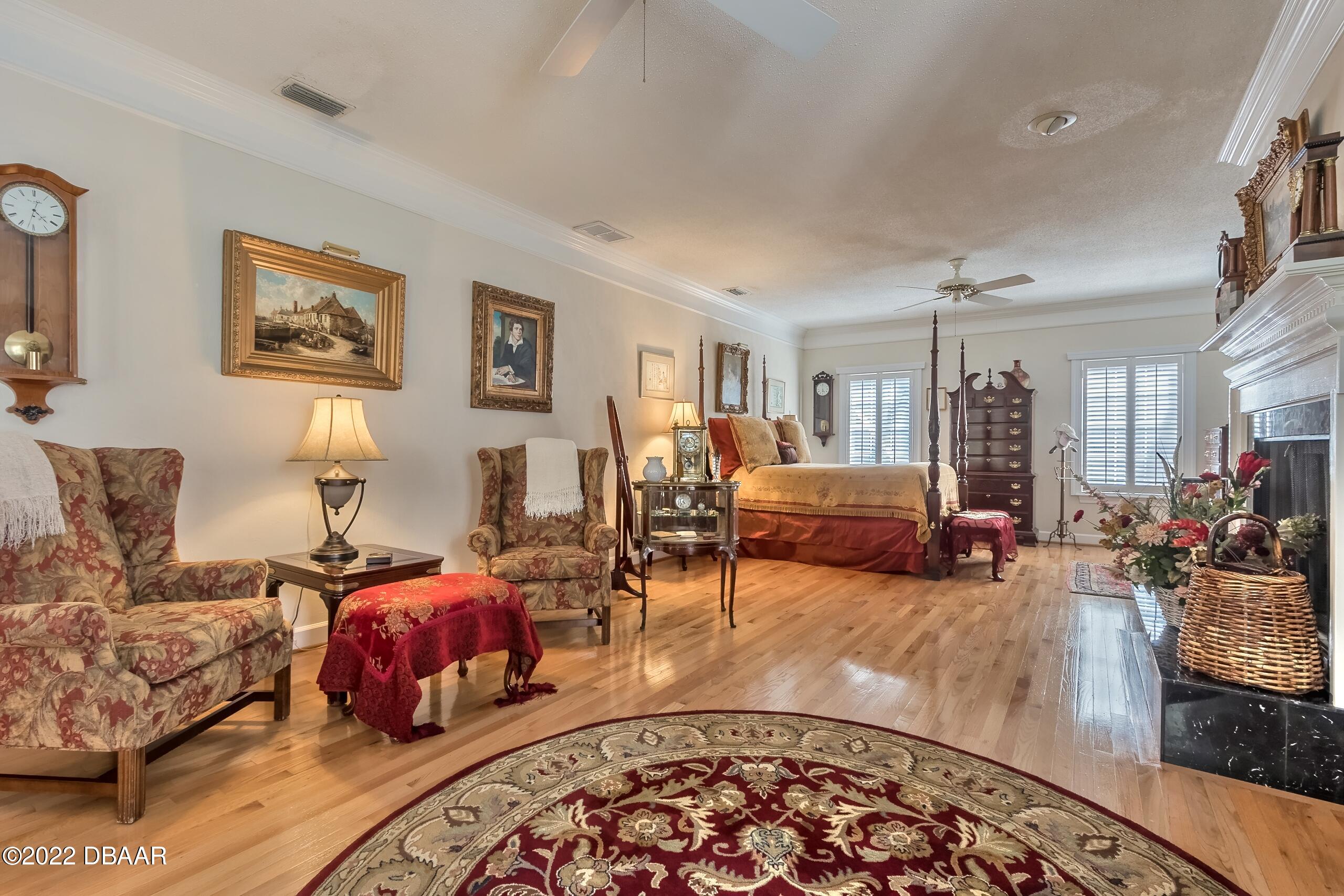 8 Moss Point Drive Ormond Beach, FL 32174 - Photo 45 of 63 a living room with furniture and wooden floor