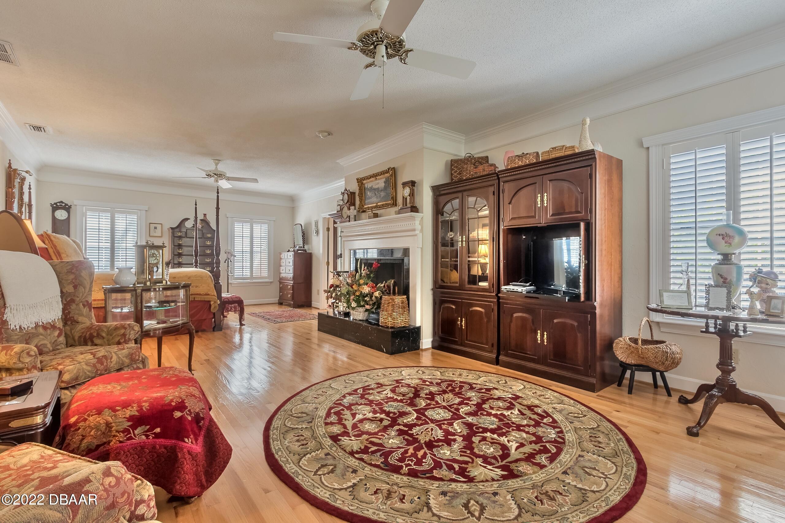 8 Moss Point Drive Ormond Beach, FL 32174 - Photo 46 of 63 a living room with furniture and a flat screen tv