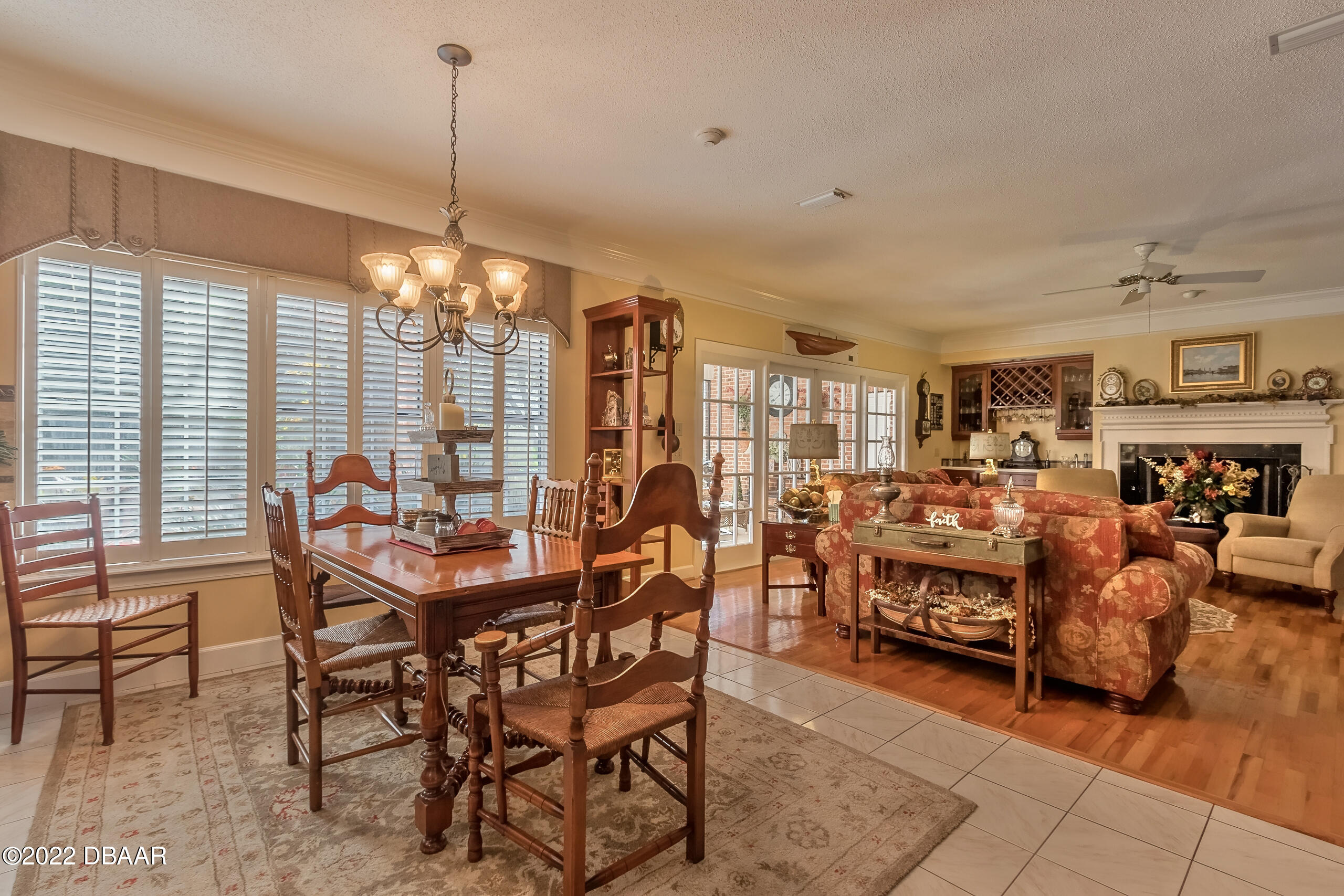 8 Moss Point Drive Ormond Beach, FL 32174 - Photo 50 of 63 a dining room filled with lots of furniture and a chandelier