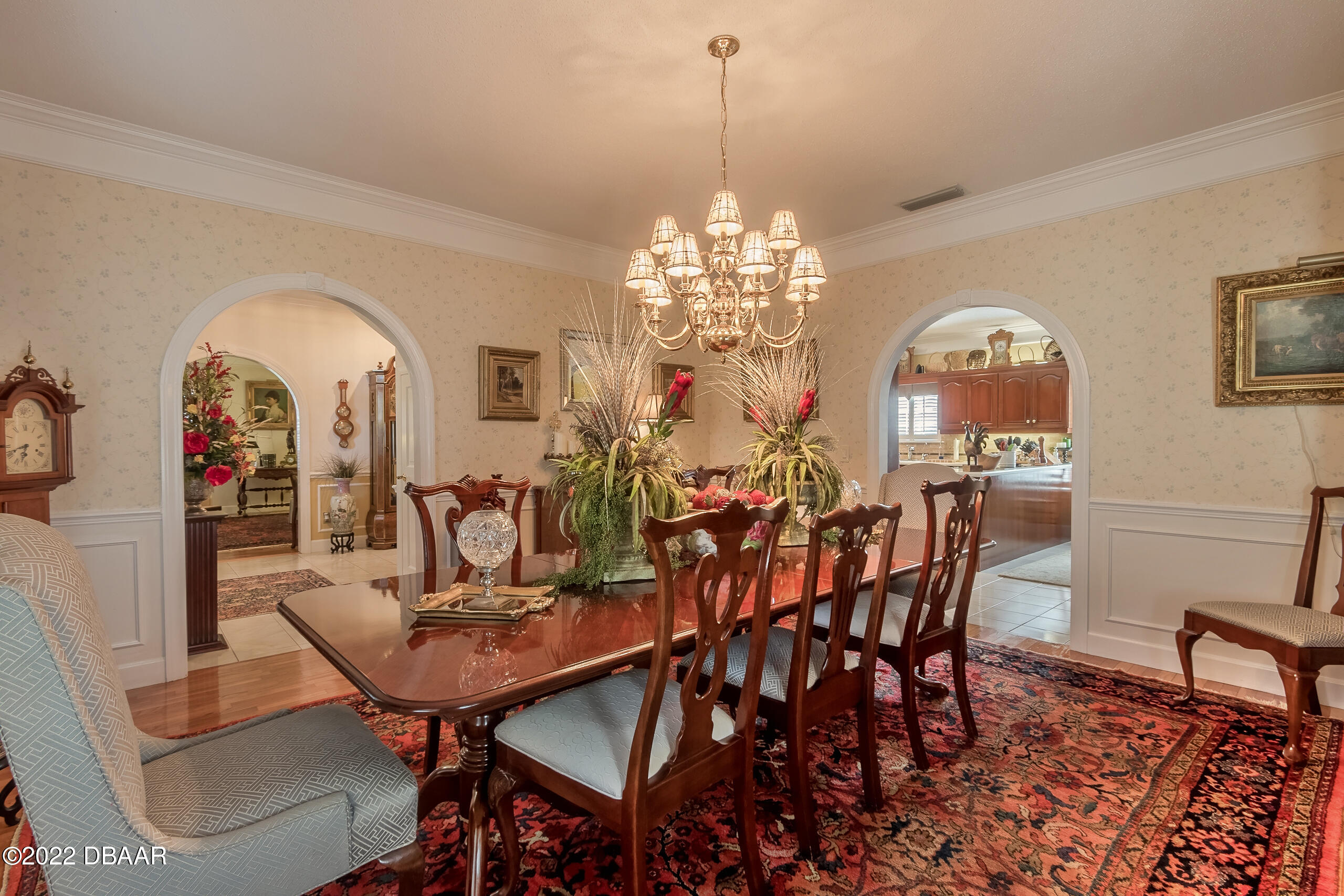 8 Moss Point Drive Ormond Beach, FL 32174 - Photo 53 of 63 a view of a dining room with furniture and chandelier