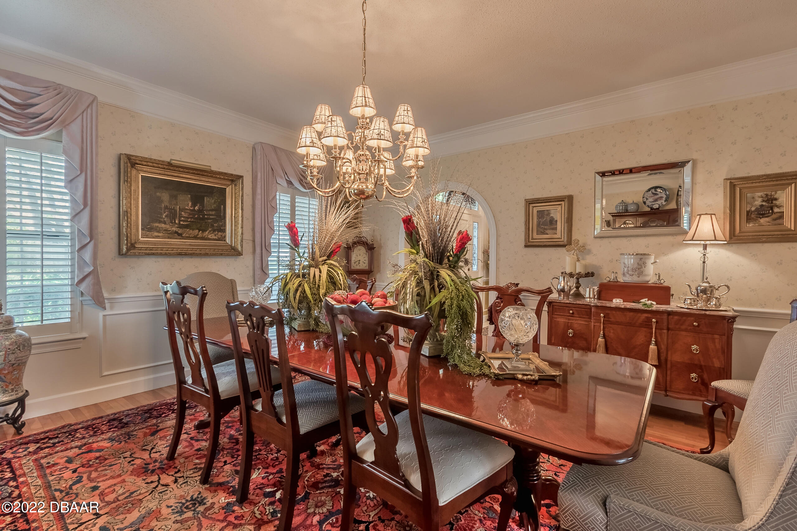 8 Moss Point Drive Ormond Beach, FL 32174 - Photo 54 of 63 a view of a dining room with furniture and chandelier