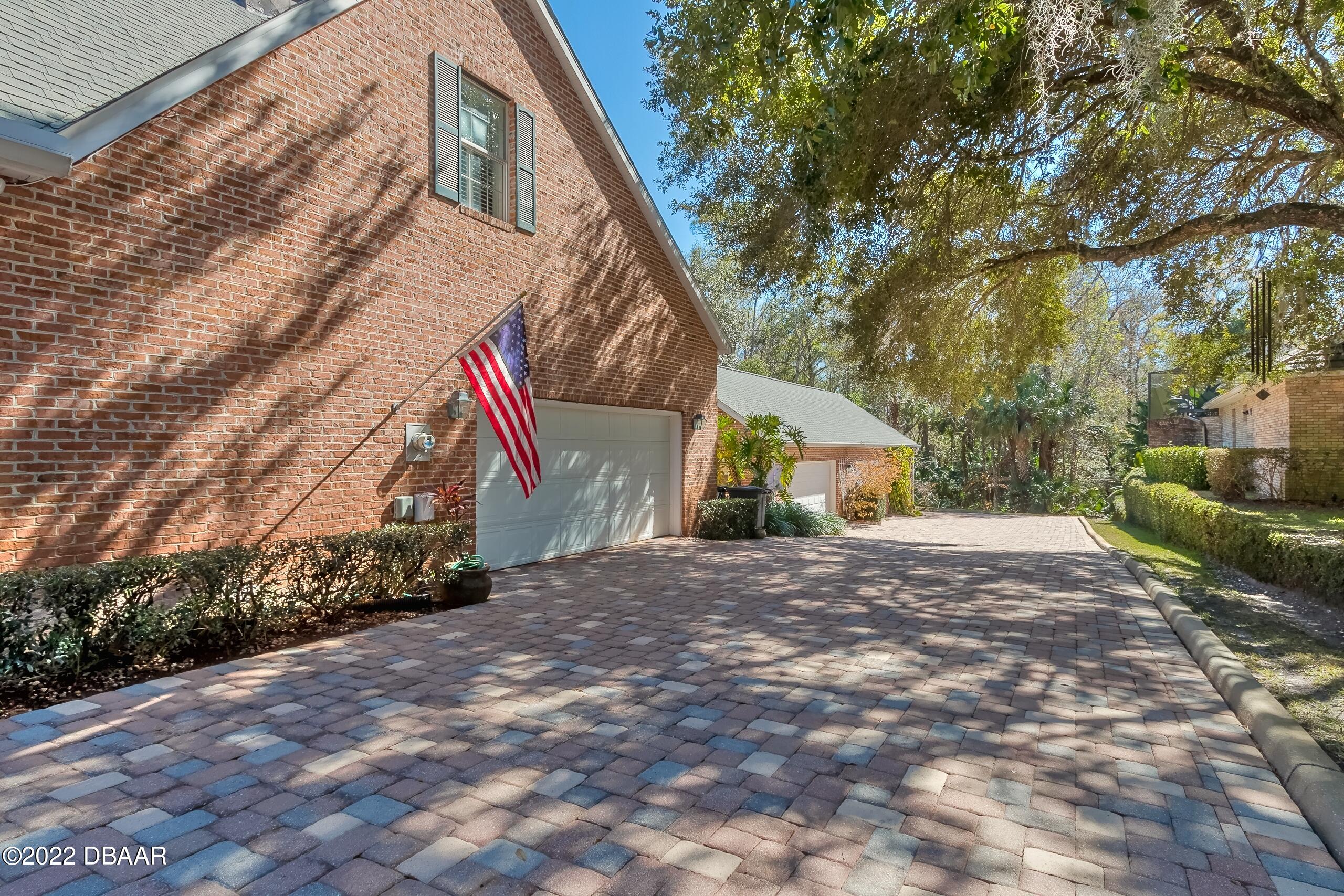 8 Moss Point Drive Ormond Beach, FL 32174 - Photo 57 of 63 a view of a house with a yard