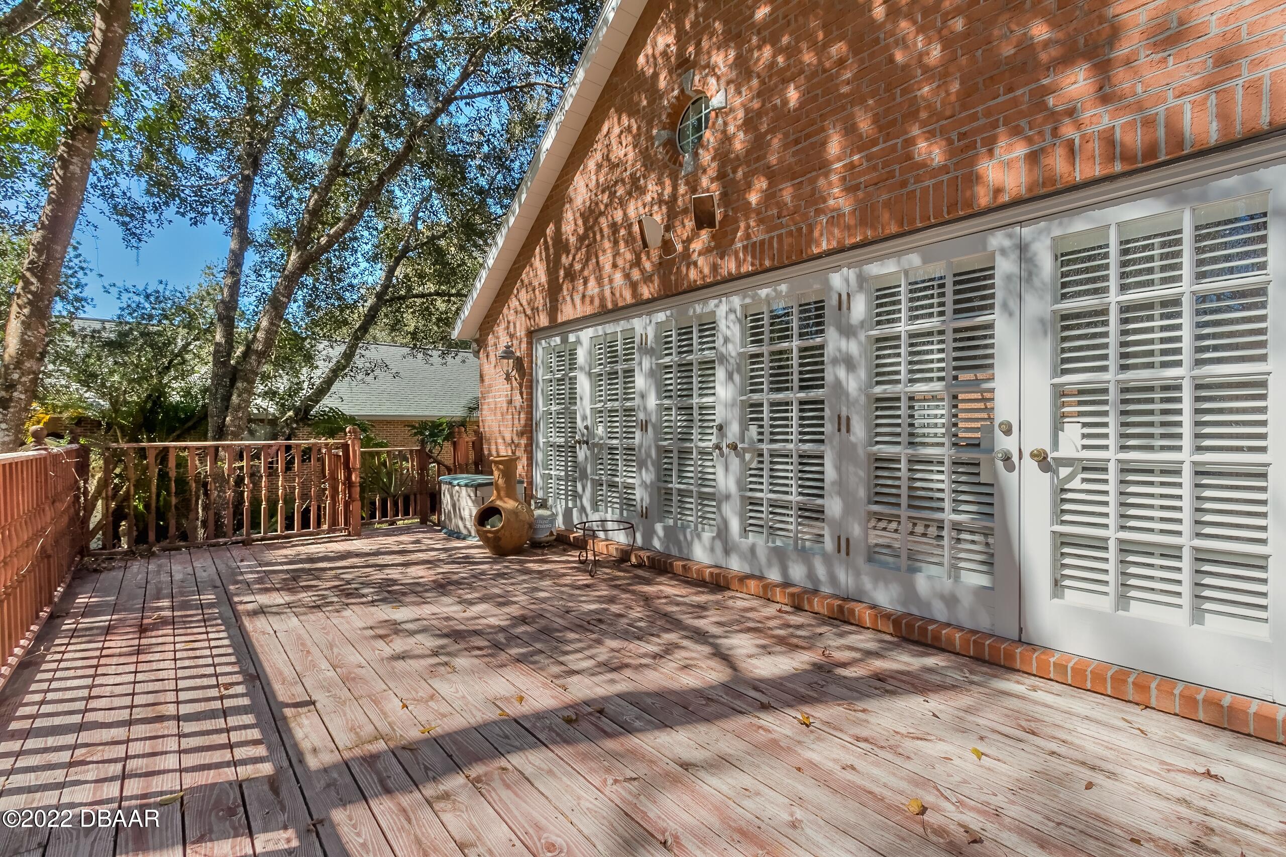 8 Moss Point Drive Ormond Beach, FL 32174 - Photo 62 of 63 a view of backyard with roof deck
